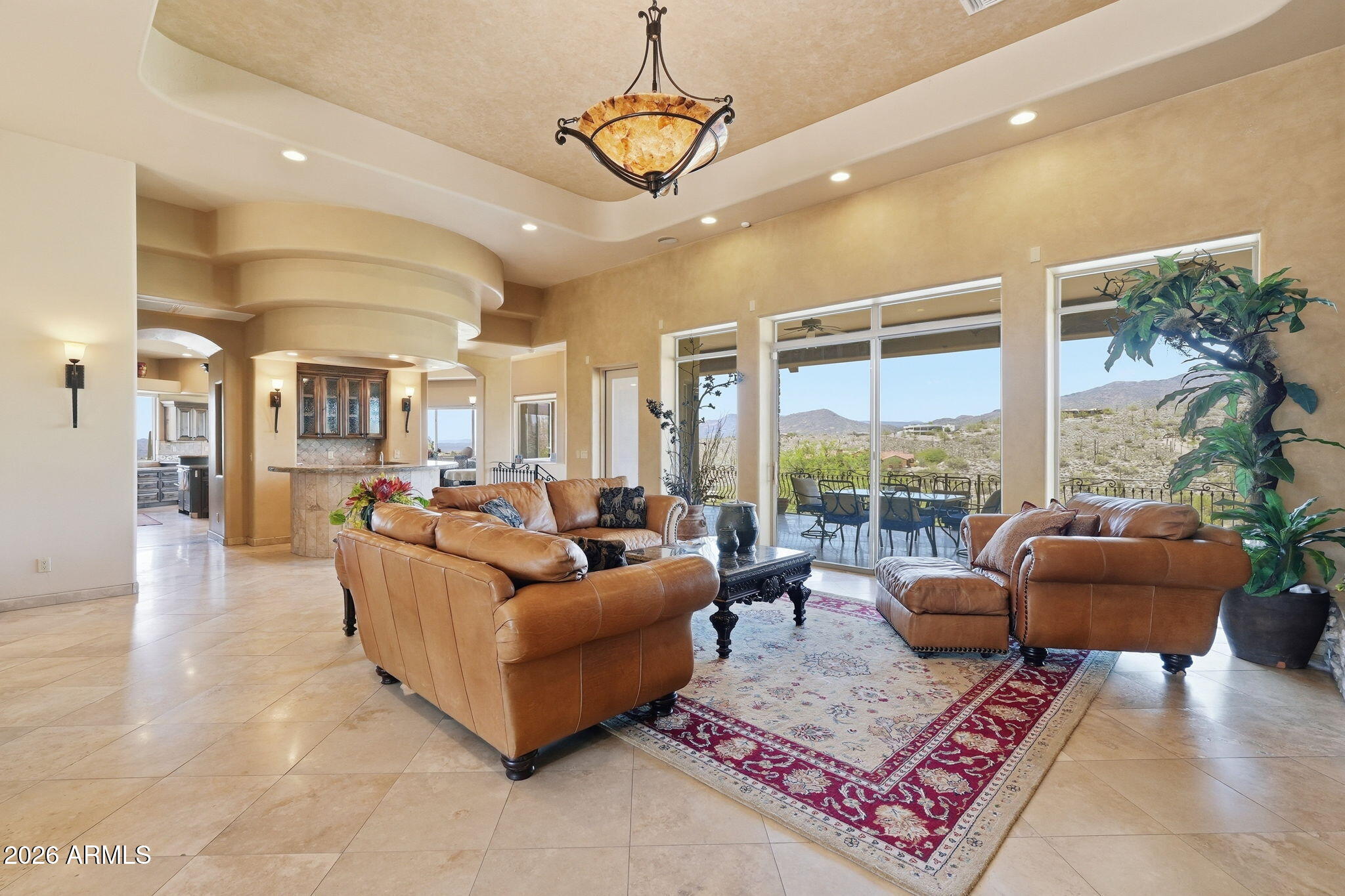 38211 North Sombrero Road Carefree, AZ 85377 - Photo 5 of 50 a living room with furniture ceiling fan and a rug