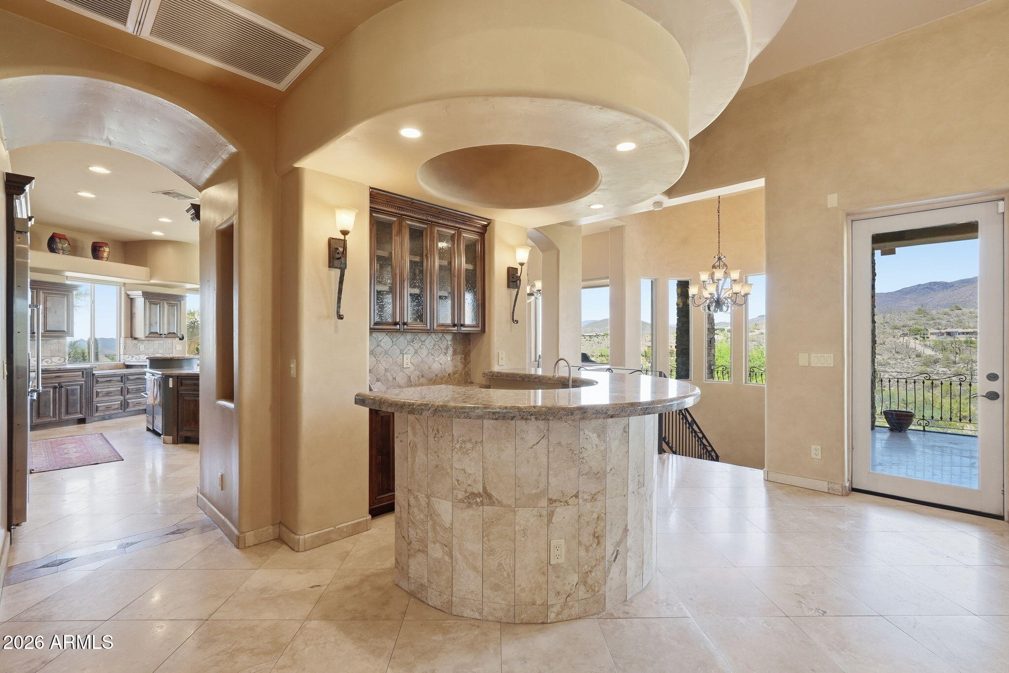 38211 North Sombrero Road Carefree, AZ 85377 - Photo 8 of 50 a dining hall with stainless steel appliances granite countertop a granite counter tops and a view of living room