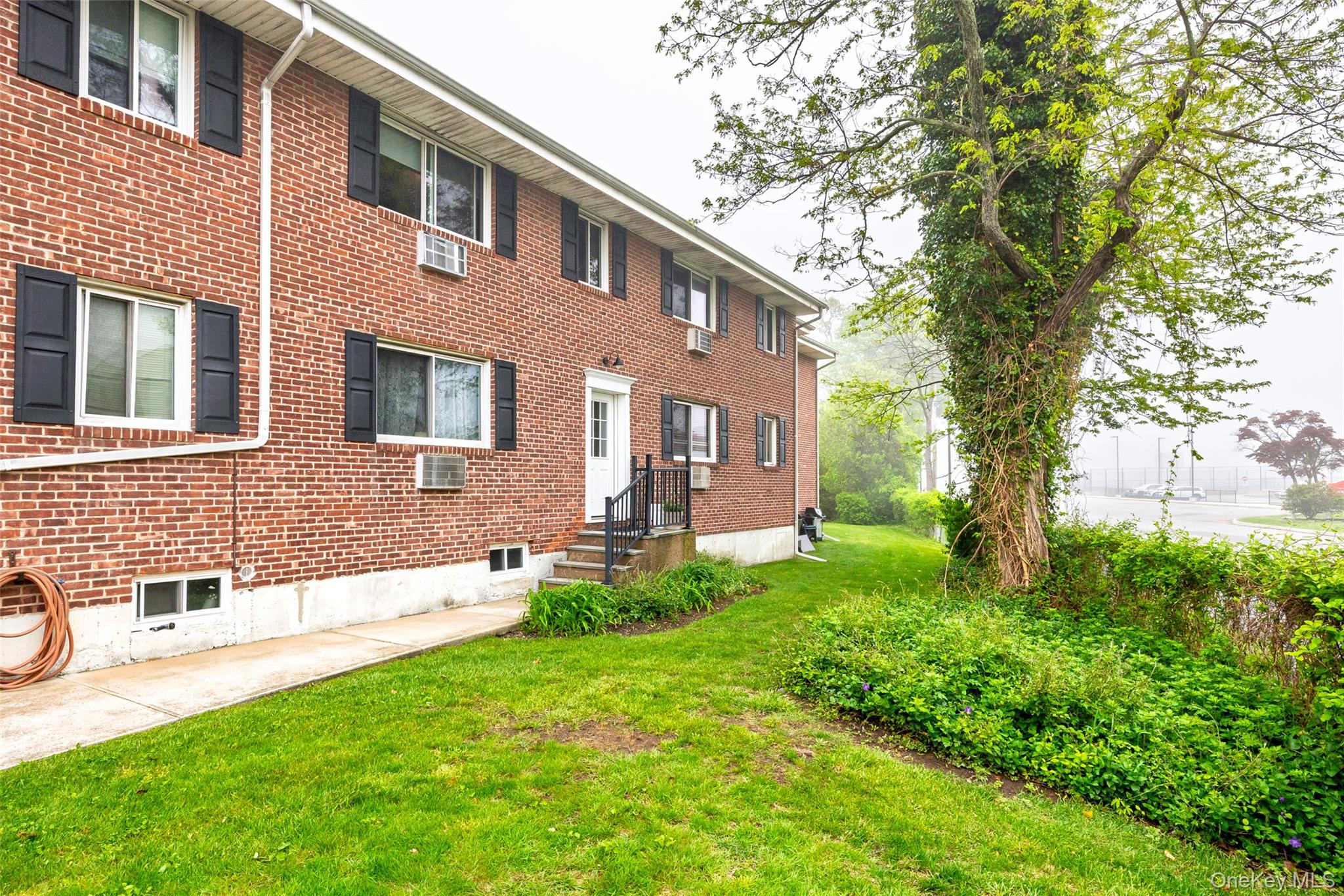 200 Merrick Road, Unit F Amityville, NY 11701 - Photo 15 of 32 Entrance closest to Parking Space