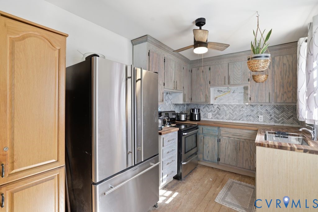 3200 Manorcrest Road Richmond, VA 23234 - Photo 26 of 34 a kitchen with granite countertop a refrigerator and a sink