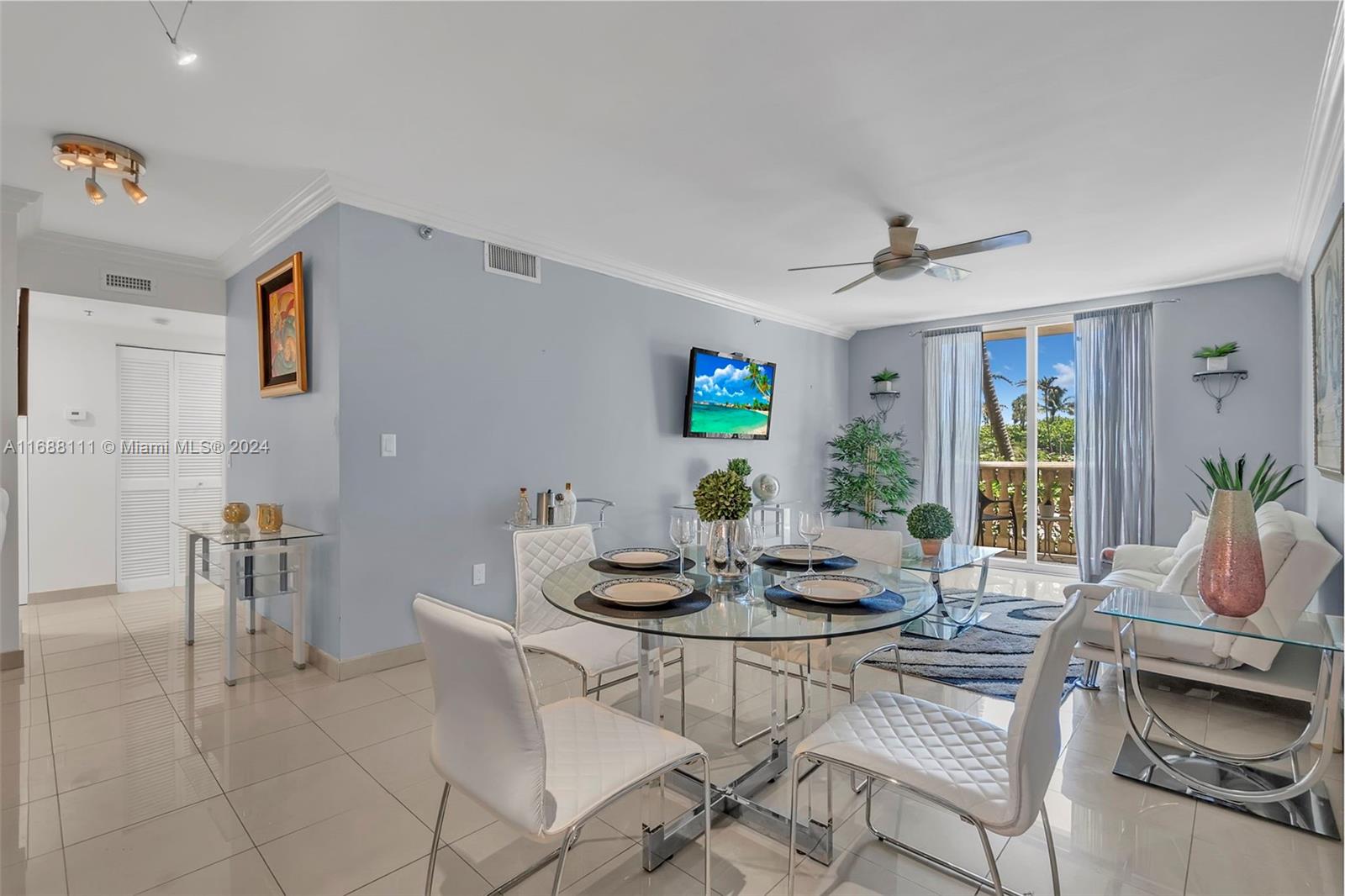 8888 Collins Avenue, Unit 113 Surfside, FL 33154 - Photo 4 of 14 a living room with furniture and a large window