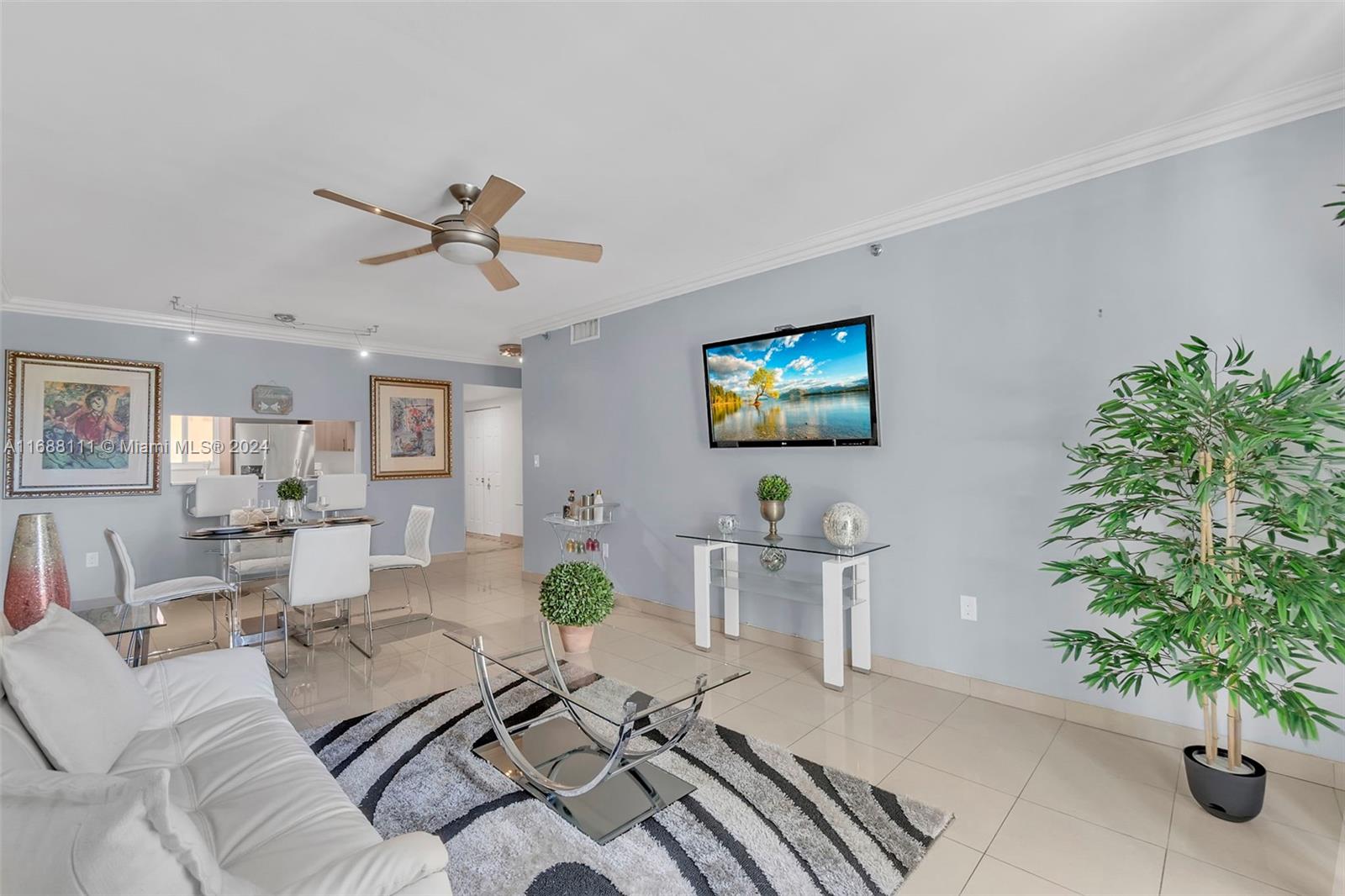 8888 Collins Avenue, Unit 113 Surfside, FL 33154 - Photo 6 of 14 a living room with furniture potted plant and a window