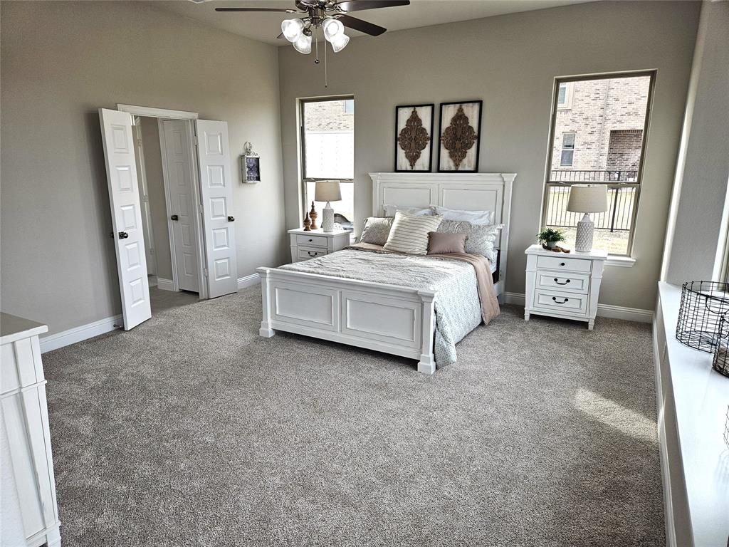 241 Blythe Road Van Alstyne, TX 75495 - Photo 15 of 37 a spacious bedroom with a bed and a window