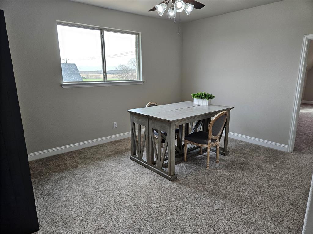 241 Blythe Road Van Alstyne, TX 75495 - Photo 25 of 37 a room with a table and a window
