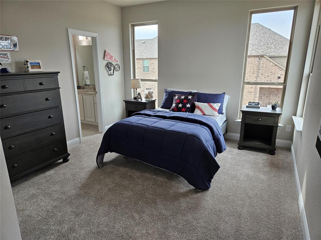 241 Blythe Road Van Alstyne, TX 75495 - Photo 30 of 37 a bedroom with a bed and a window