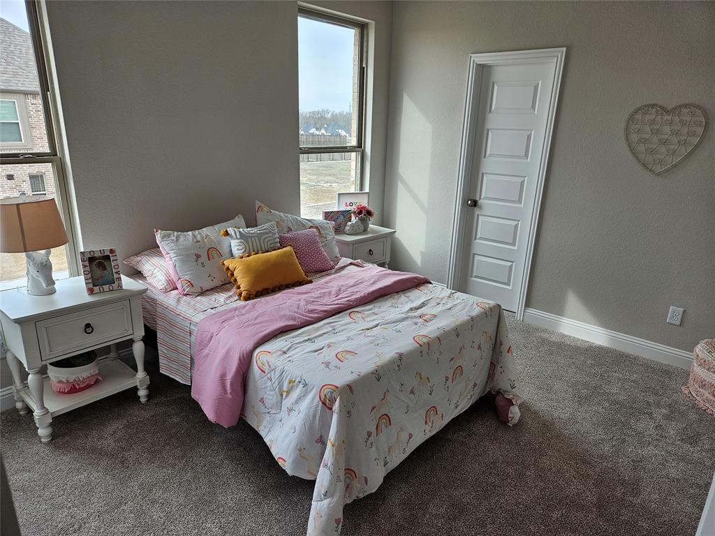 241 Blythe Road Van Alstyne, TX 75495 - Photo 32 of 37 a bedroom with a bed and a window