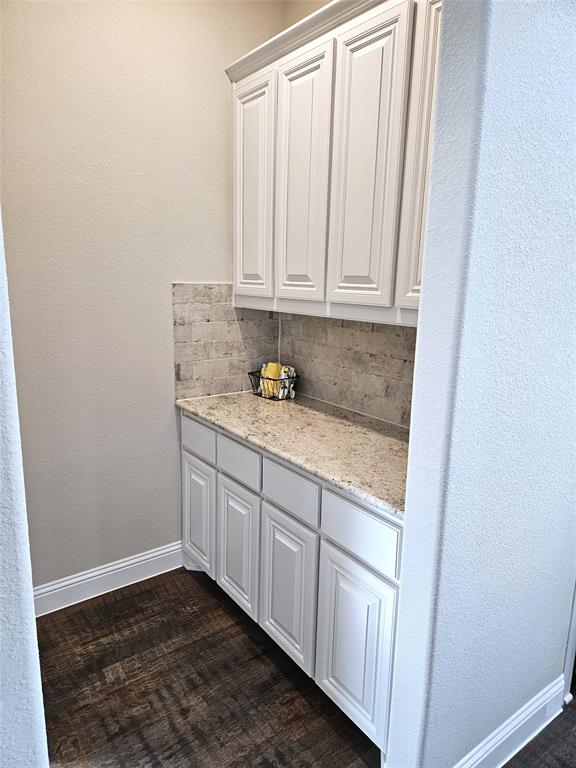 241 Blythe Road Van Alstyne, TX 75495 - Photo 5 of 37 a bathroom with a granite countertop sink and cabinets