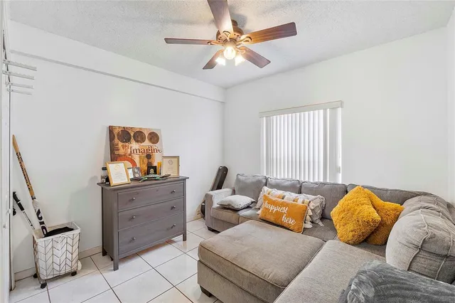 a bedroom with furniture and wooden floor
