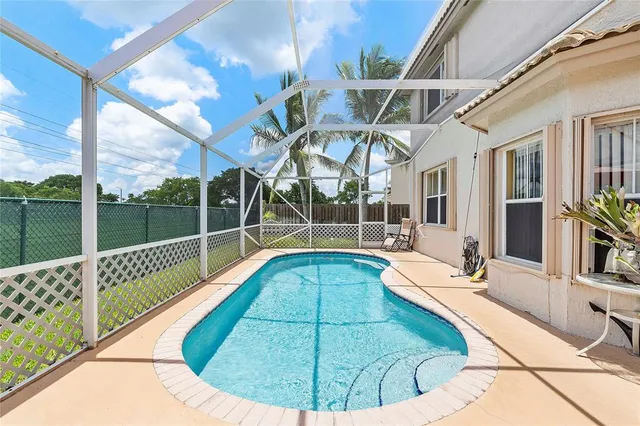 a view of a swimming pool with a patio
