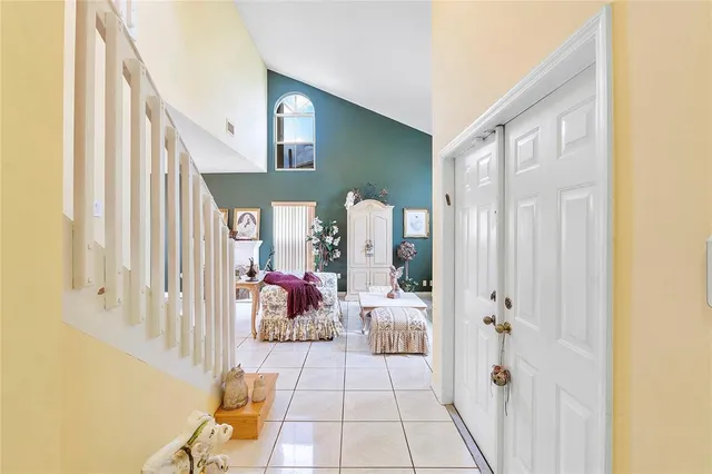 a view of a livingroom with furniture and front door