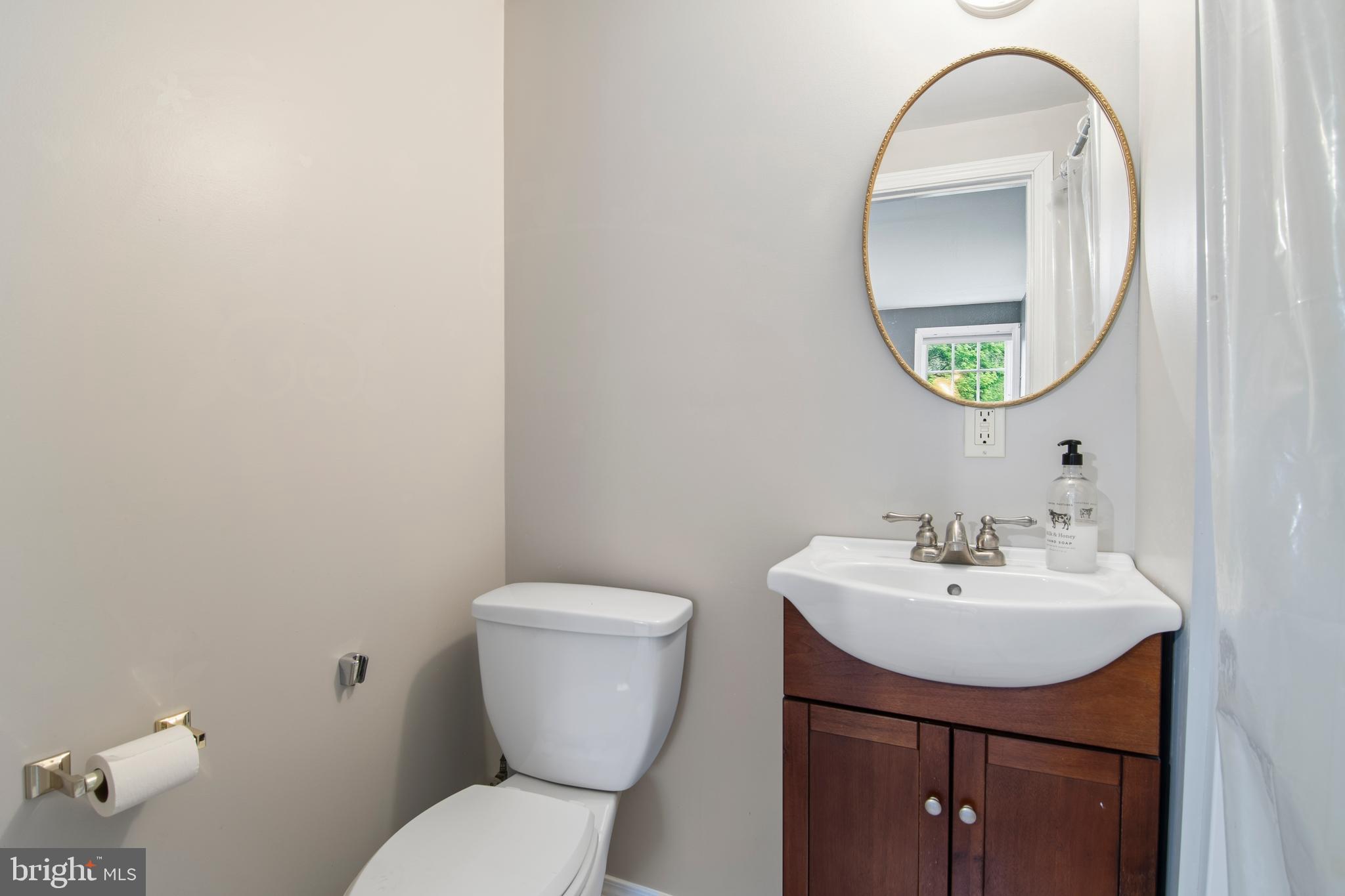 18708 York Road Parkton, MD 21120 - Photo 27 of 59 a bathroom with a toilet a sink and a mirror