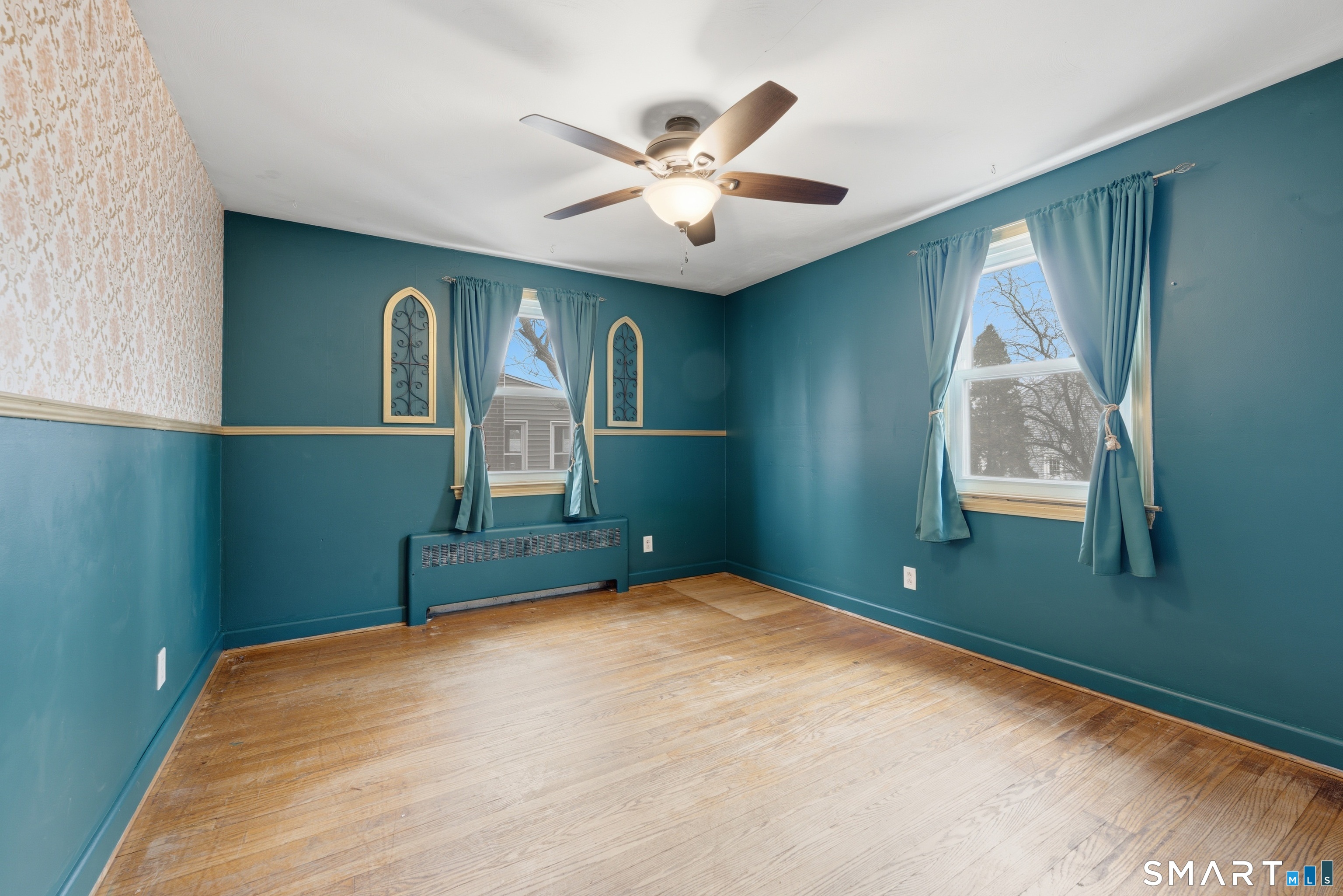 71 Hatch Street New Britain, CT 06053 - Photo 12 of 34 a bedroom with a large bed and a window