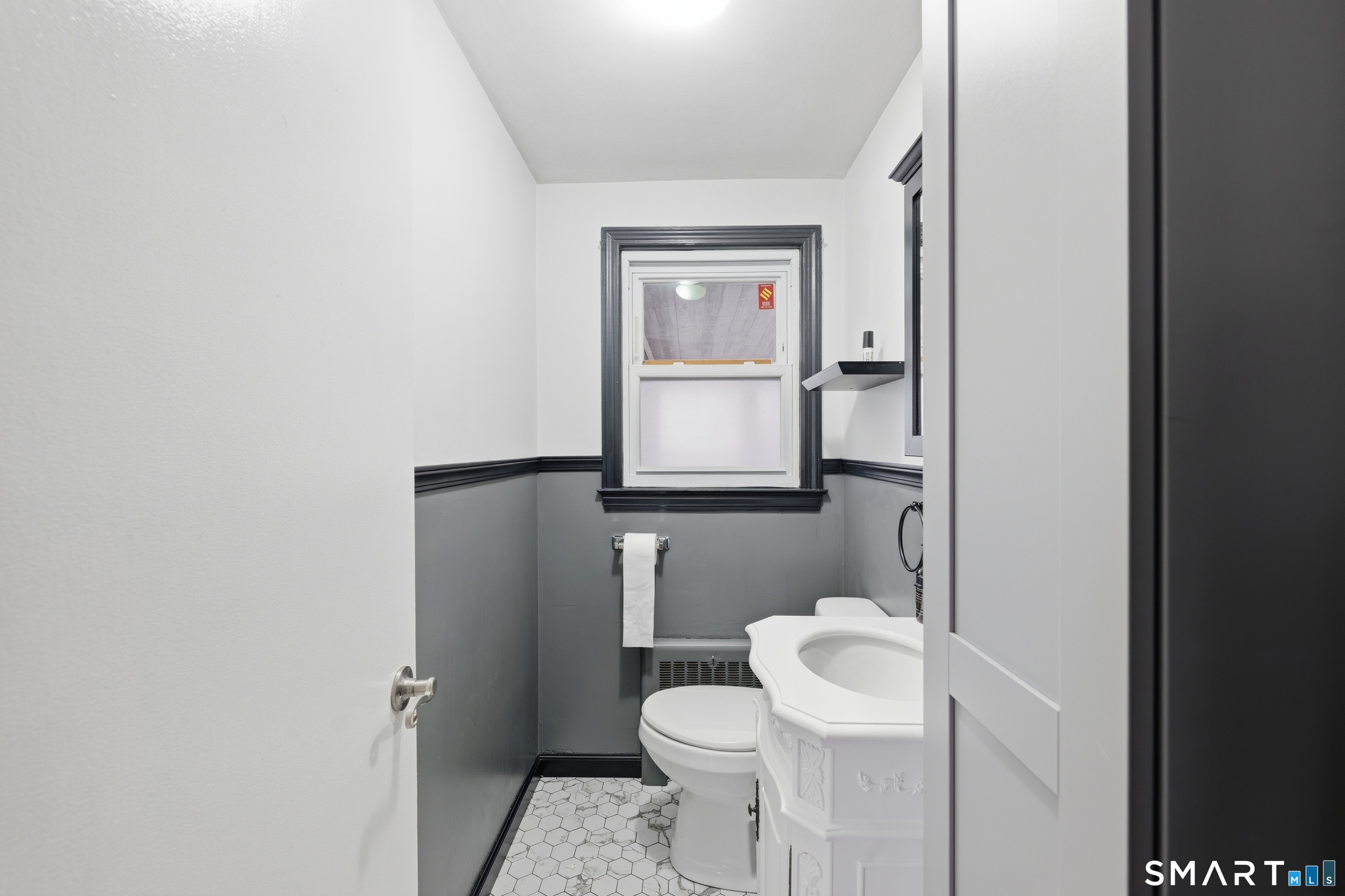71 Hatch Street New Britain, CT 06053 - Photo 14 of 34 a white toilet sitting next to a bathroom sink