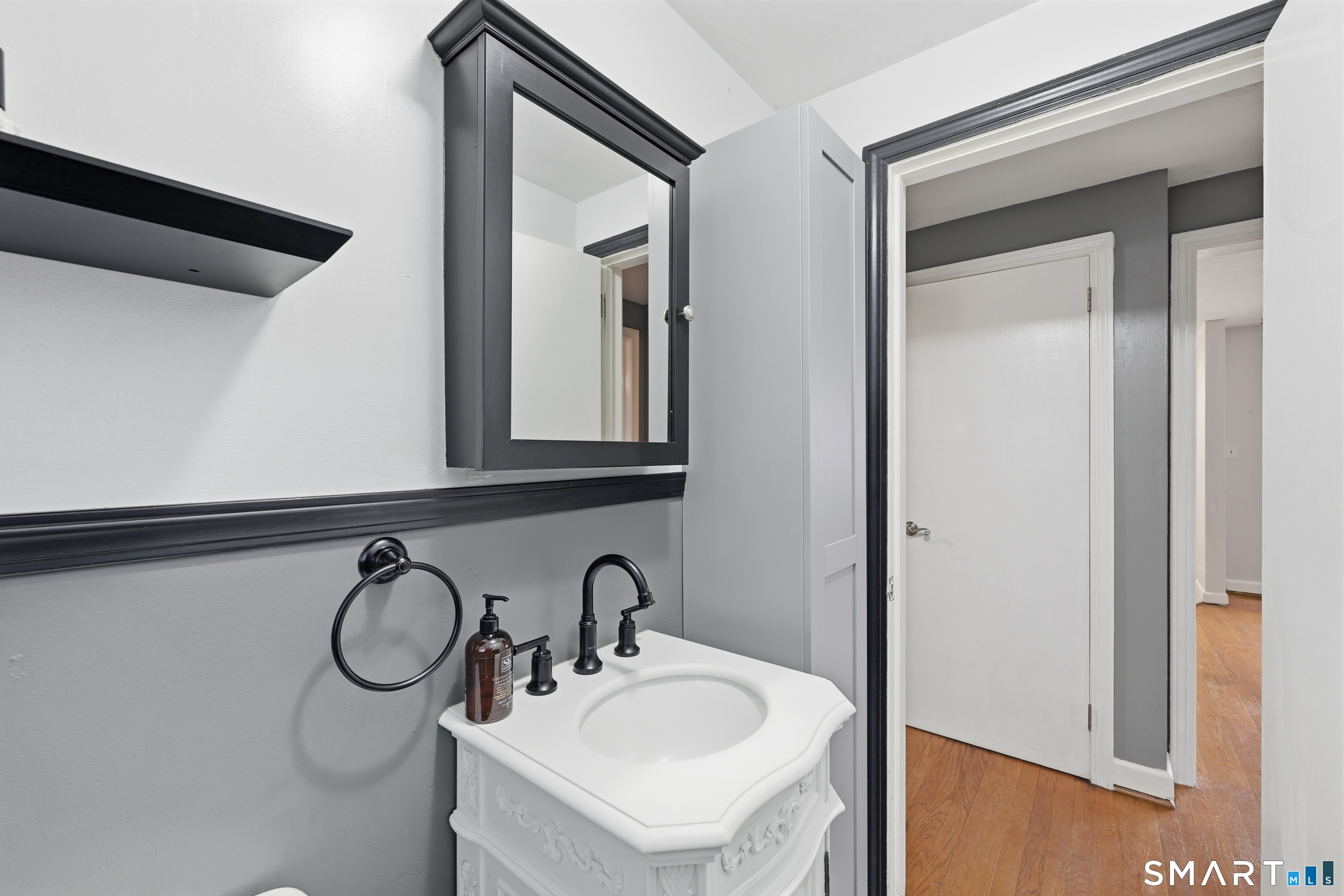71 Hatch Street New Britain, CT 06053 - Photo 15 of 34 a bathroom with a sink and a mirror