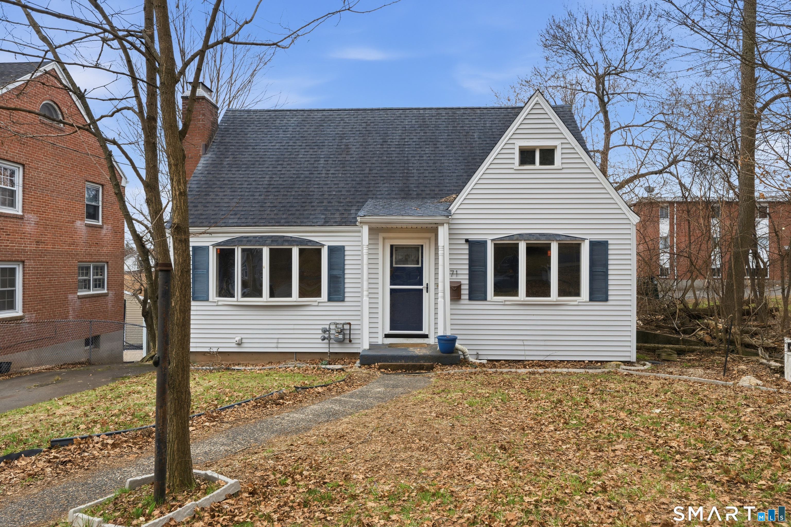 71 Hatch Street New Britain, CT 06053 - Photo 2 of 34 a front view of a house with a yard
