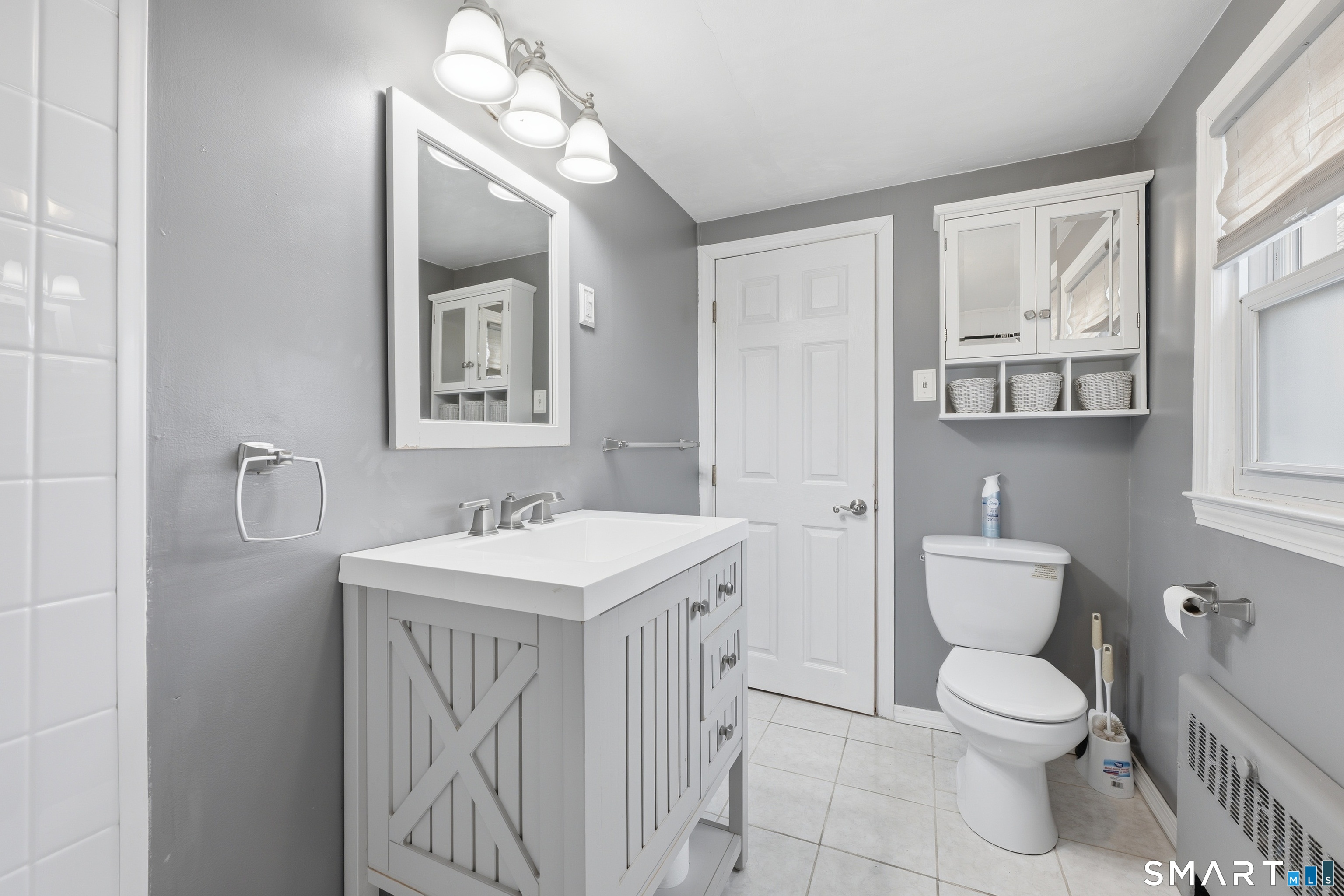 71 Hatch Street New Britain, CT 06053 - Photo 27 of 34 a bathroom with a toilet a sink and mirror