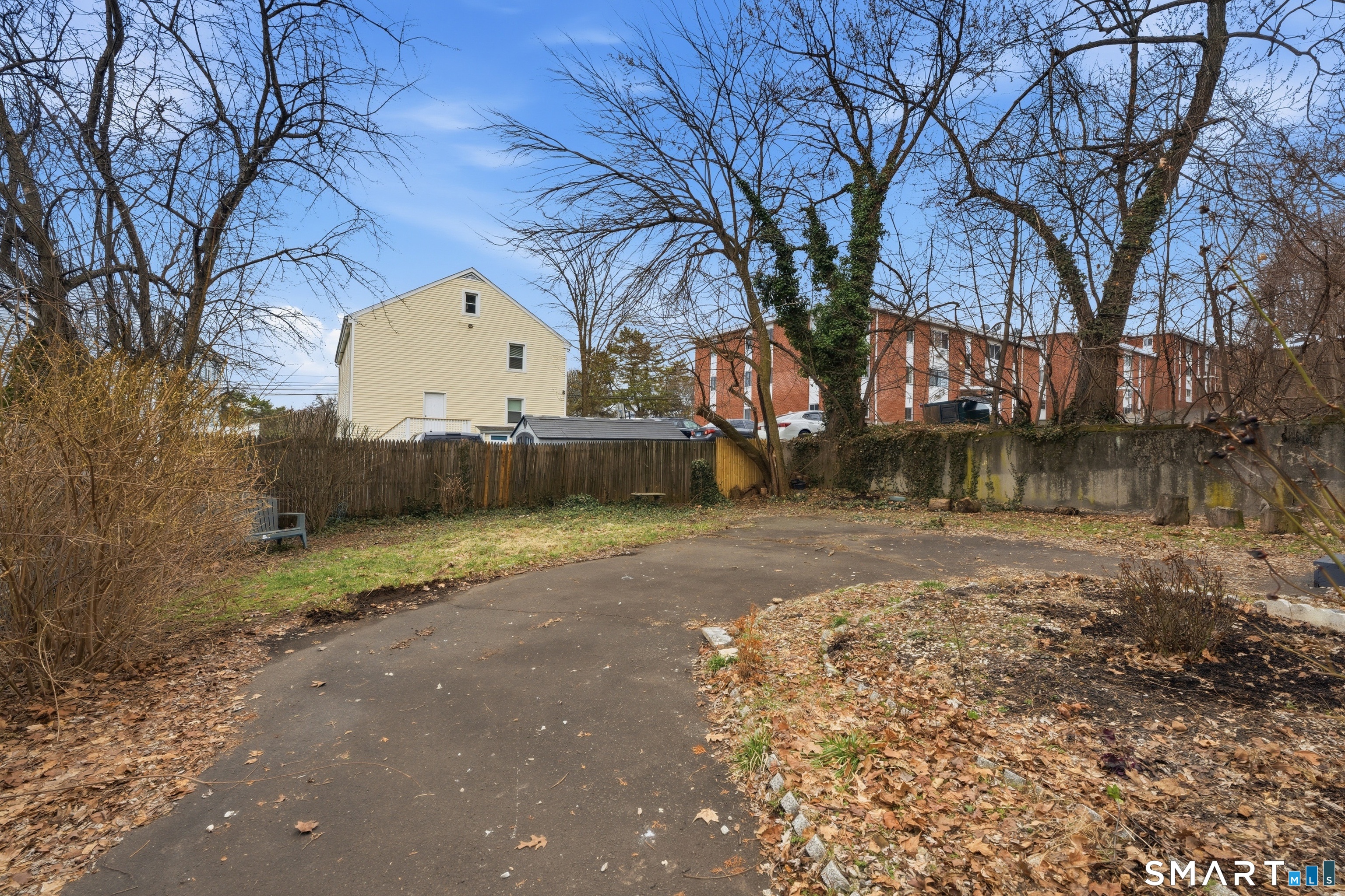 71 Hatch Street New Britain, CT 06053 - Photo 30 of 34 a view of a yard with a large tree