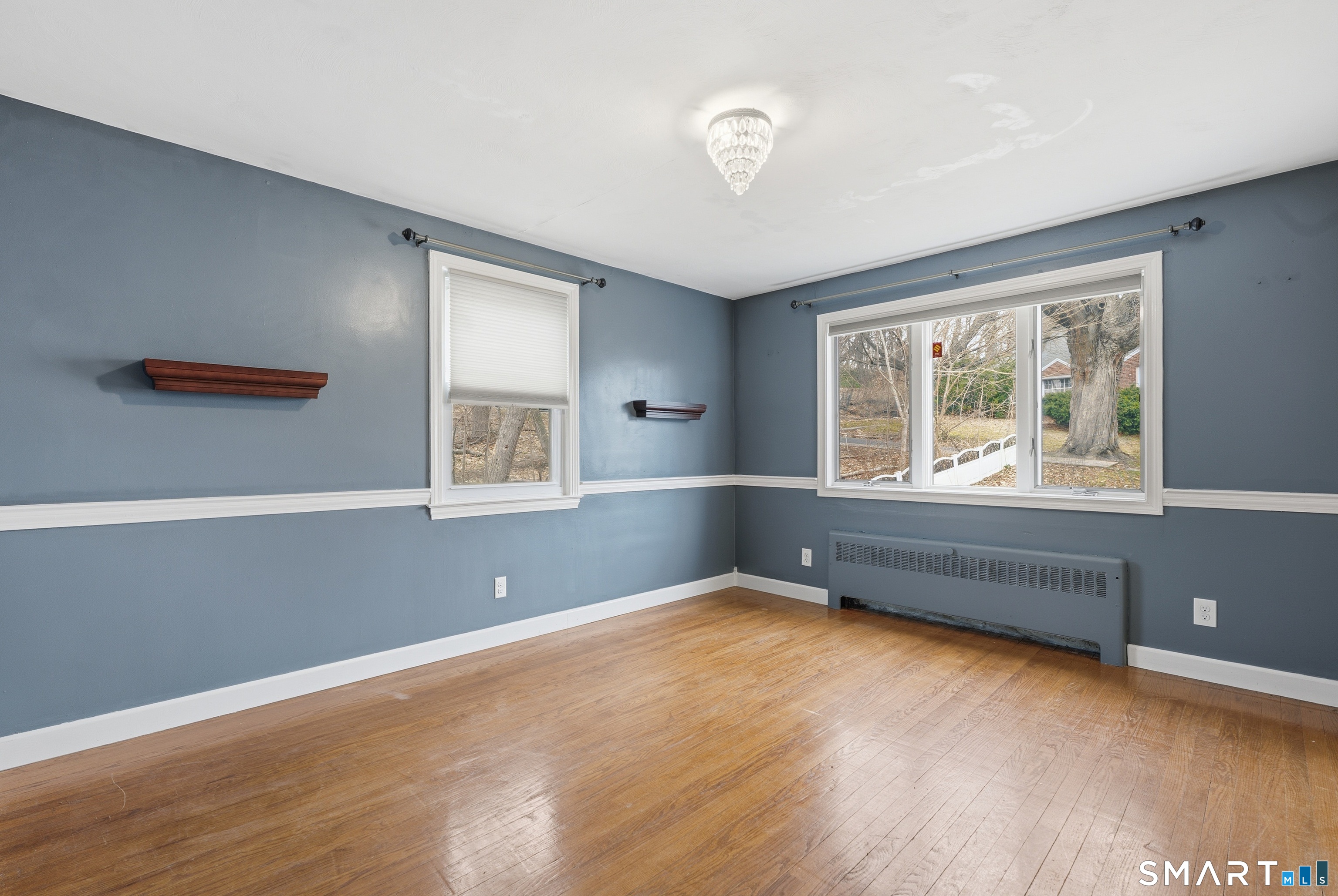 71 Hatch Street New Britain, CT 06053 - Photo 9 of 34 a view of an empty room with wooden floor and a window