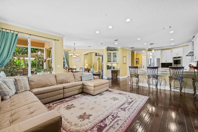 a spacious bathroom with a tub sink and mirror