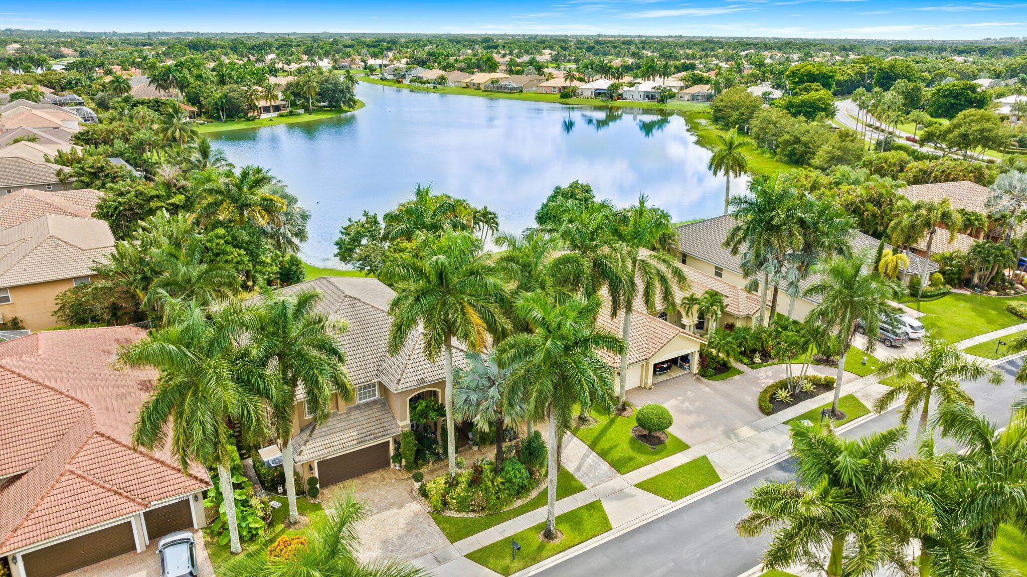 21167 Falls Ridge Way Boca Raton, FL 33428 - Photo 2 of 72 an aerial view of residential houses with outdoor space and trees
