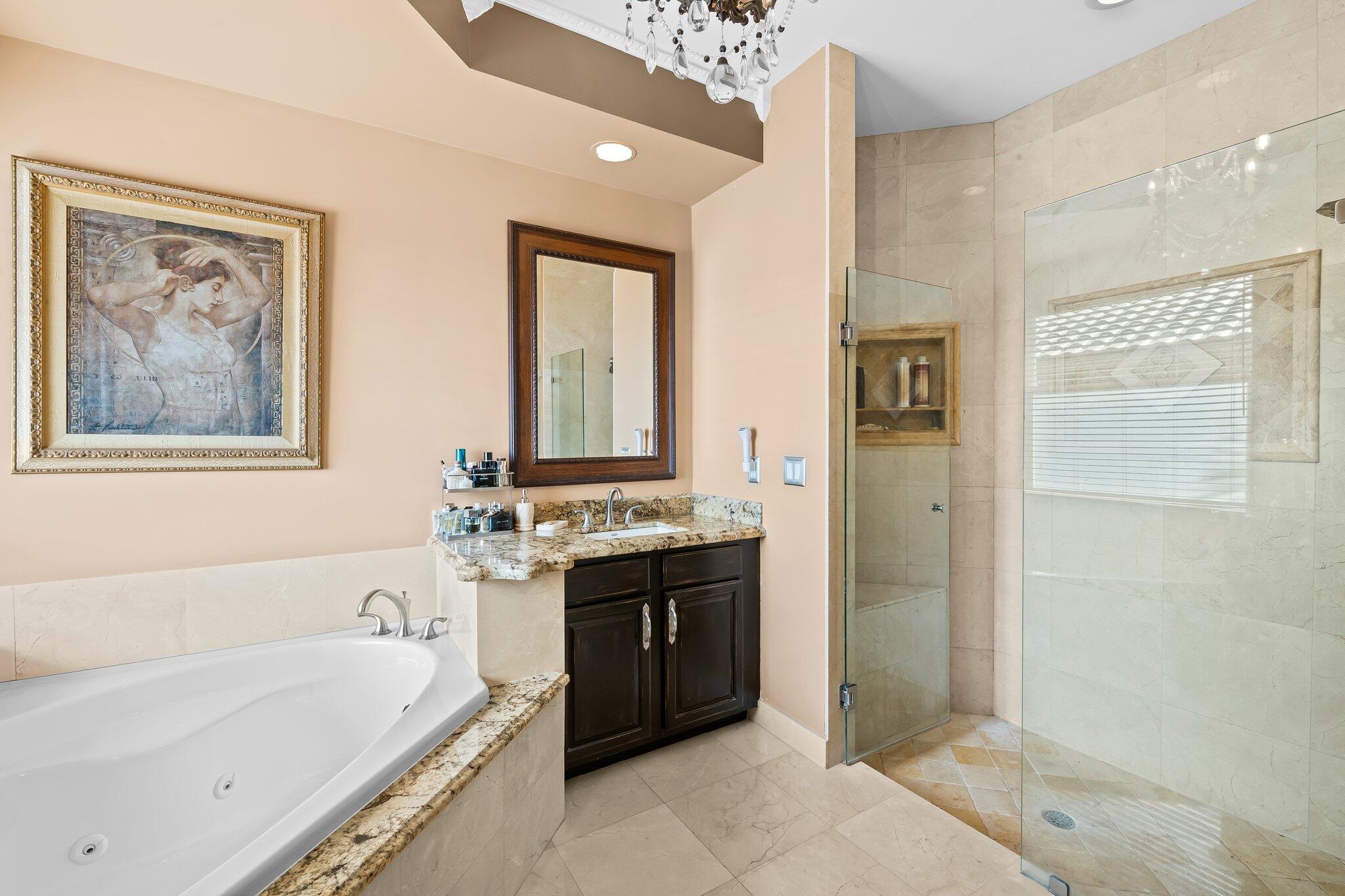 21167 Falls Ridge Way Boca Raton, FL 33428 - Photo 25 of 72 a spacious bathroom with a tub sink and mirror