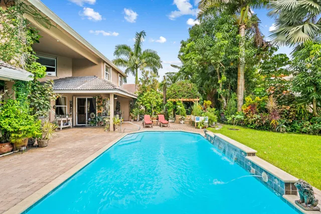 a living room with lots of furniture and a flat screen tv
