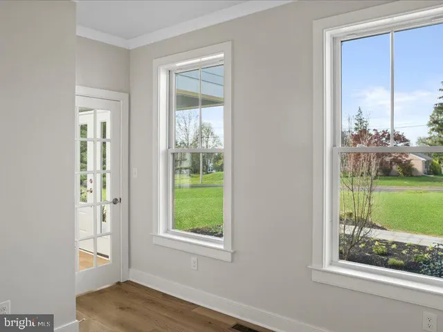 a kitchen with white cabinets and a sink