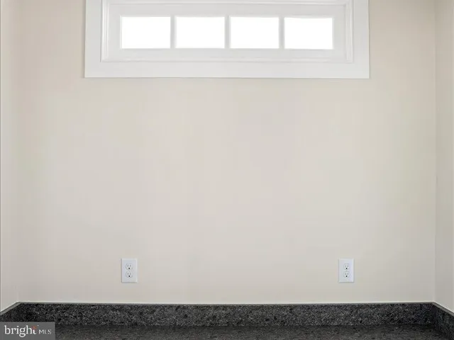 a kitchen with stainless steel appliances granite countertop a lot of cabinets and wooden floor