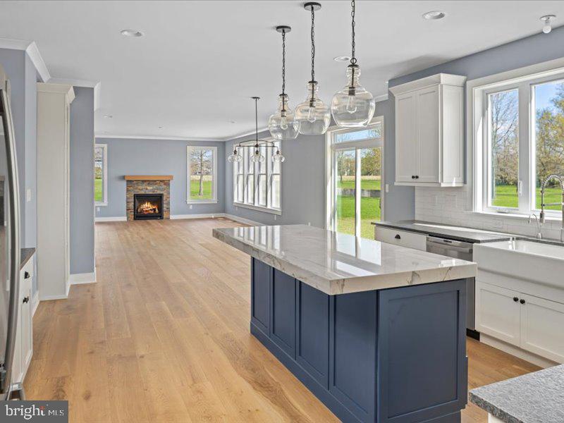 1 Groveland Road Pipersville, PA 18947 - Photo 19 of 65 a kitchen with kitchen island granite countertop a sink cabinets and window
