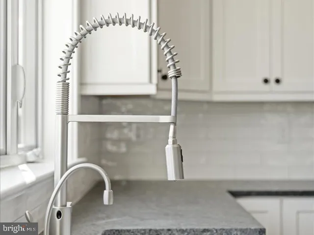 a living room with a fireplace and a window