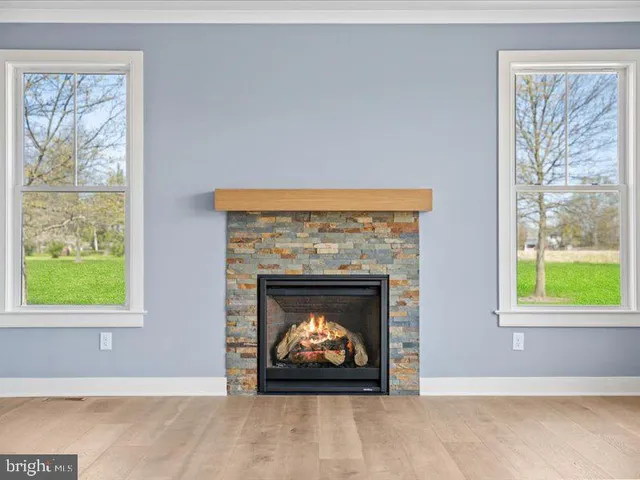 a view of an entryway with wooden floor