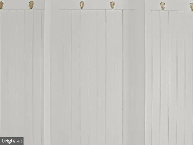 a white bath tub sitting next to a window