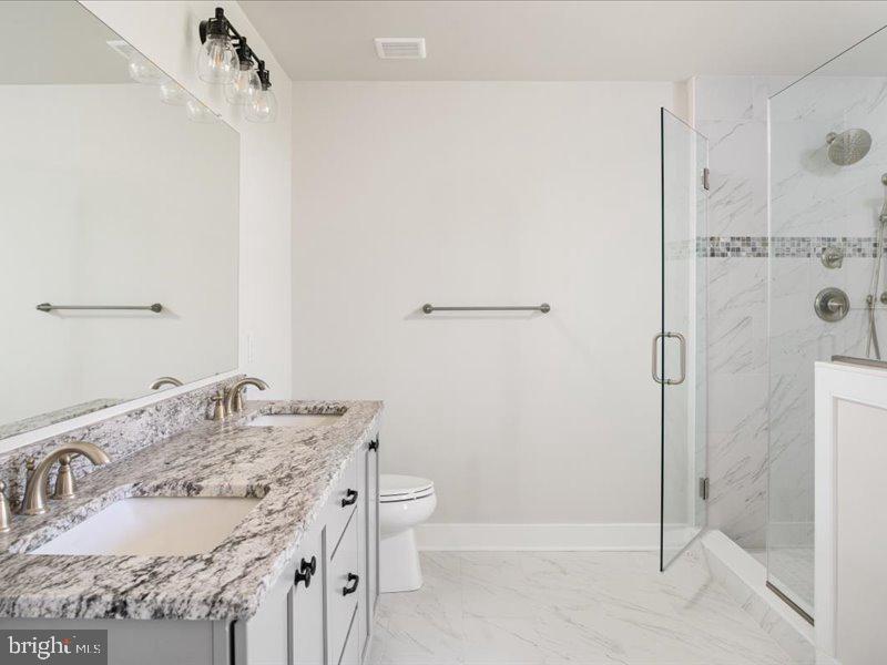 1 Groveland Road Pipersville, PA 18947 - Photo 48 of 65 a bathroom with a granite countertop sink a toilet and shower