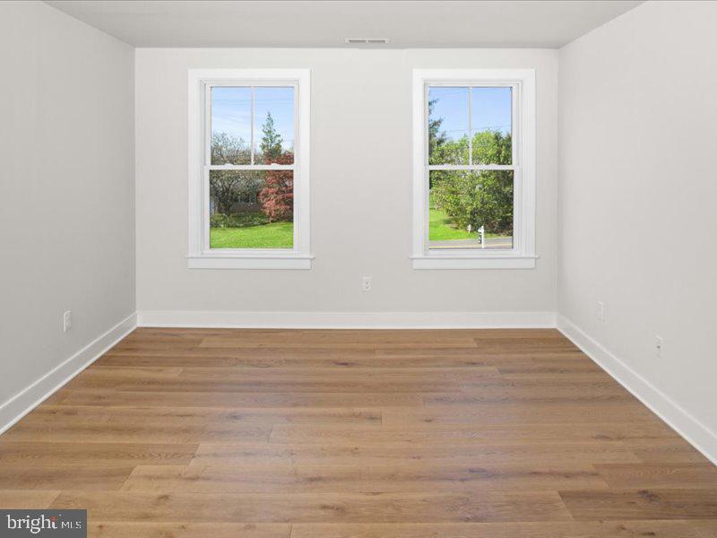 1 Groveland Road Pipersville, PA 18947 - Photo 58 of 65 a view of an empty room with wooden floor and a window