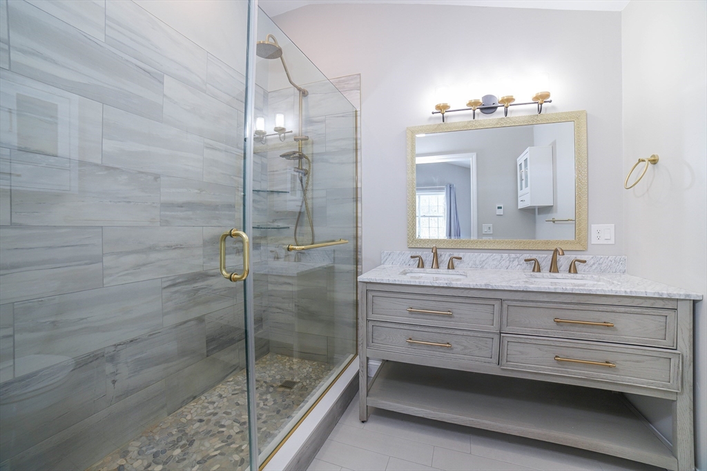 3 Woods Road Westminster, MA 01473 - Photo 23 of 42 a bathroom with a double vanity sink mirror and shower