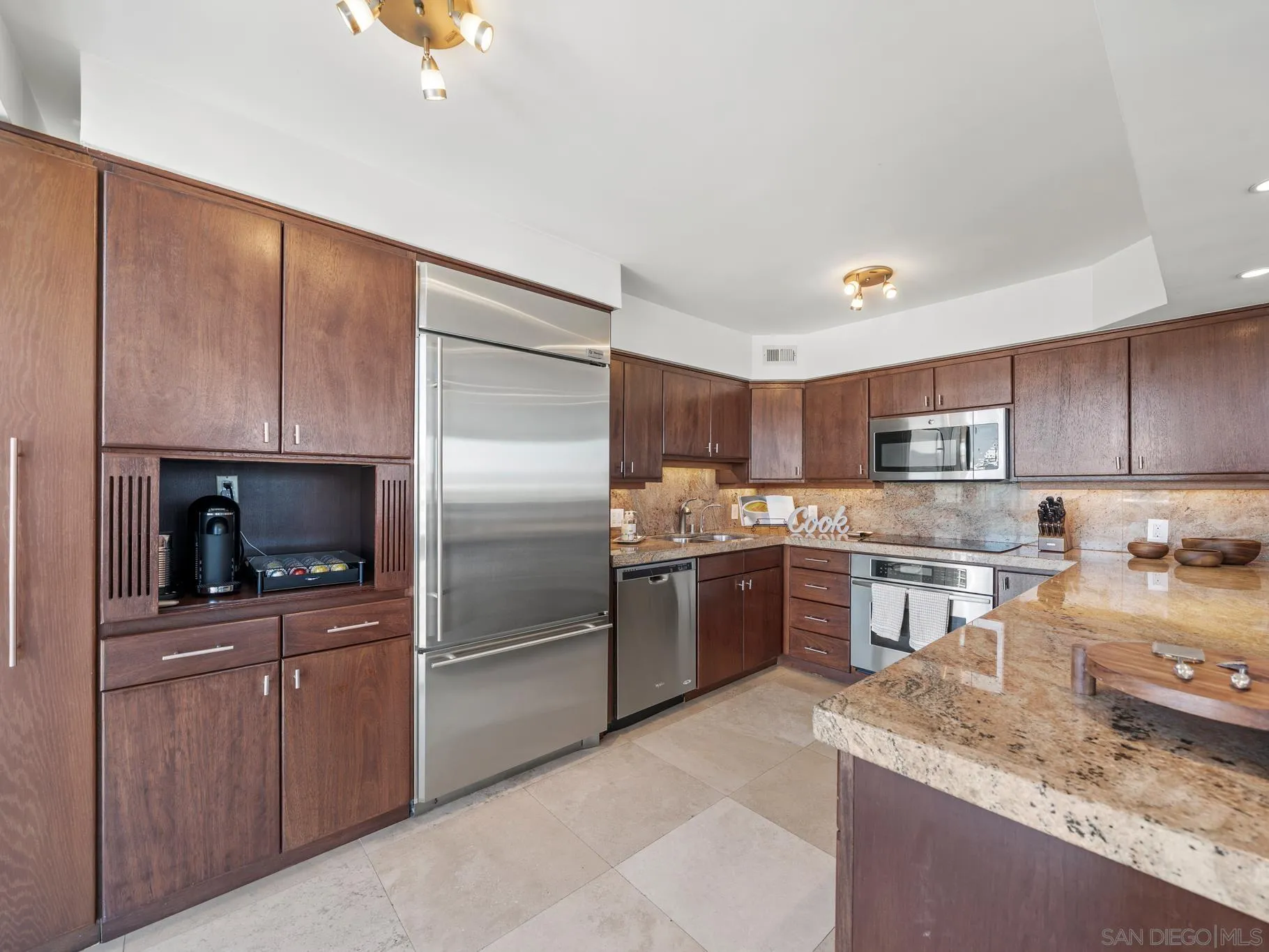 1730 Avenida Del Mundo, Unit 1503 Coronado, CA 92118 - Photo 12 of 47 a kitchen with a sink microwave and refrigerator