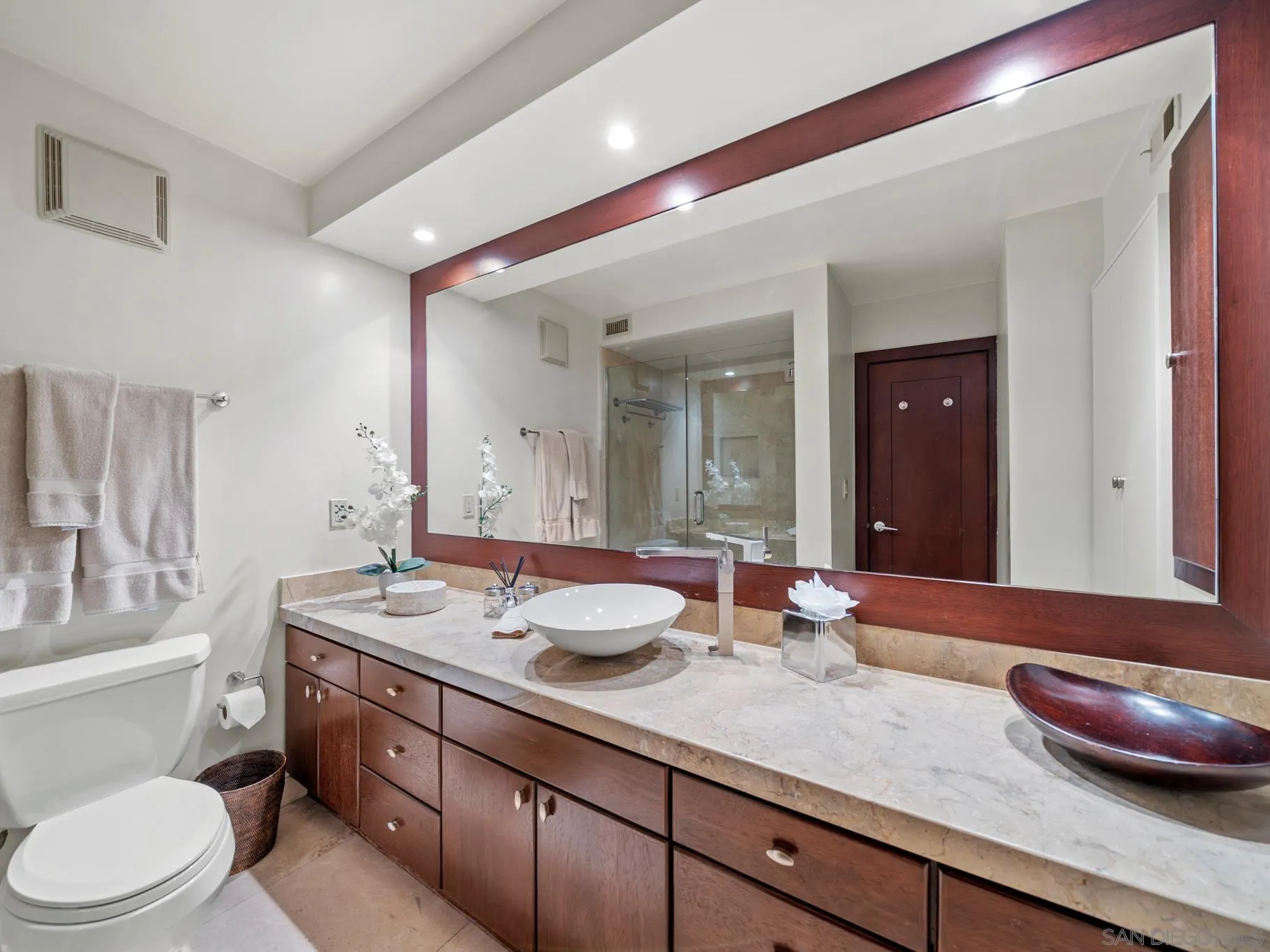 1730 Avenida Del Mundo, Unit 1503 Coronado, CA 92118 - Photo 18 of 47 a bathroom with a granite countertop sink mirror and toilet