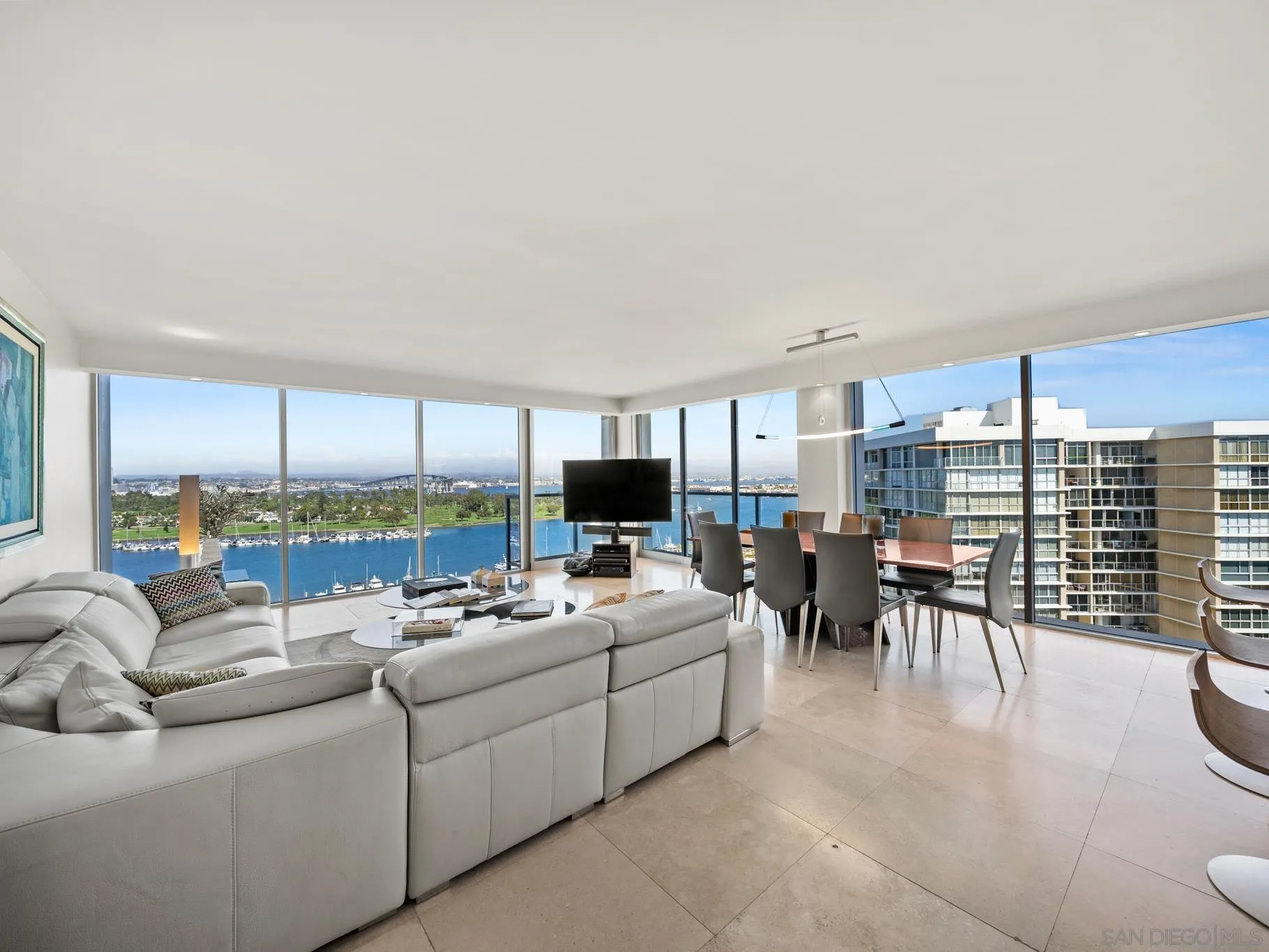 1730 Avenida Del Mundo, Unit 1503 Coronado, CA 92118 - Photo 2 of 47 a living room with furniture kitchen view and a large window