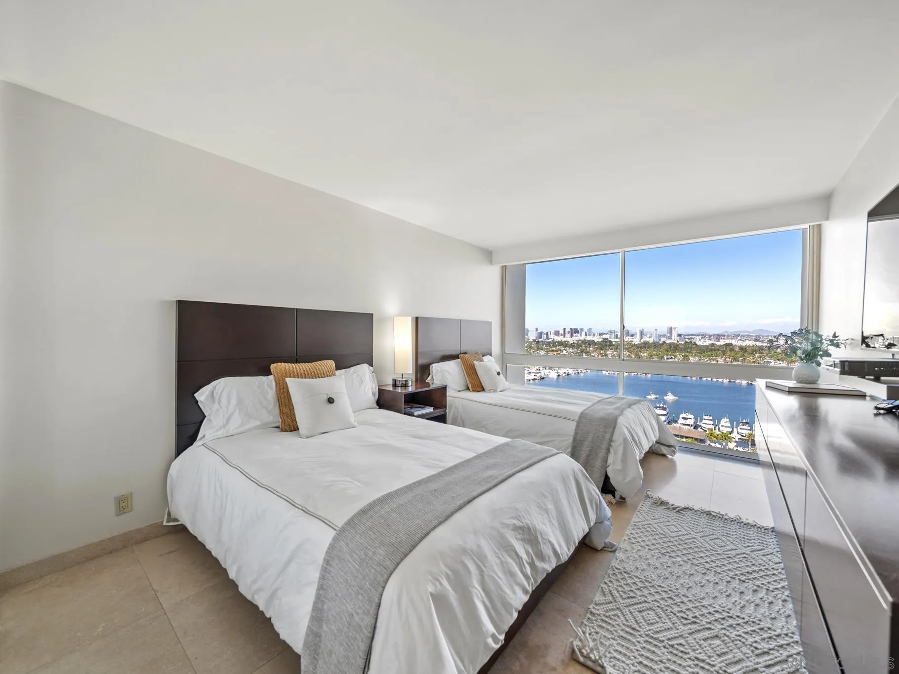 1730 Avenida Del Mundo, Unit 1503 Coronado, CA 92118 - Photo 28 of 47 a bedroom with bed and a view of kitchen