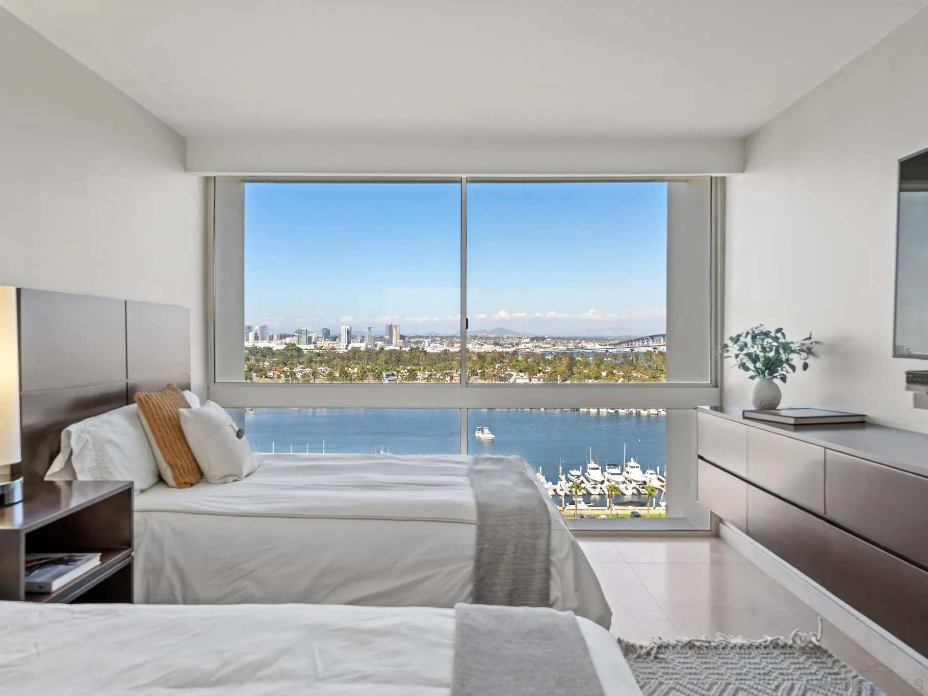 1730 Avenida Del Mundo, Unit 1503 Coronado, CA 92118 - Photo 29 of 47 a living room with a couch and a potted plant