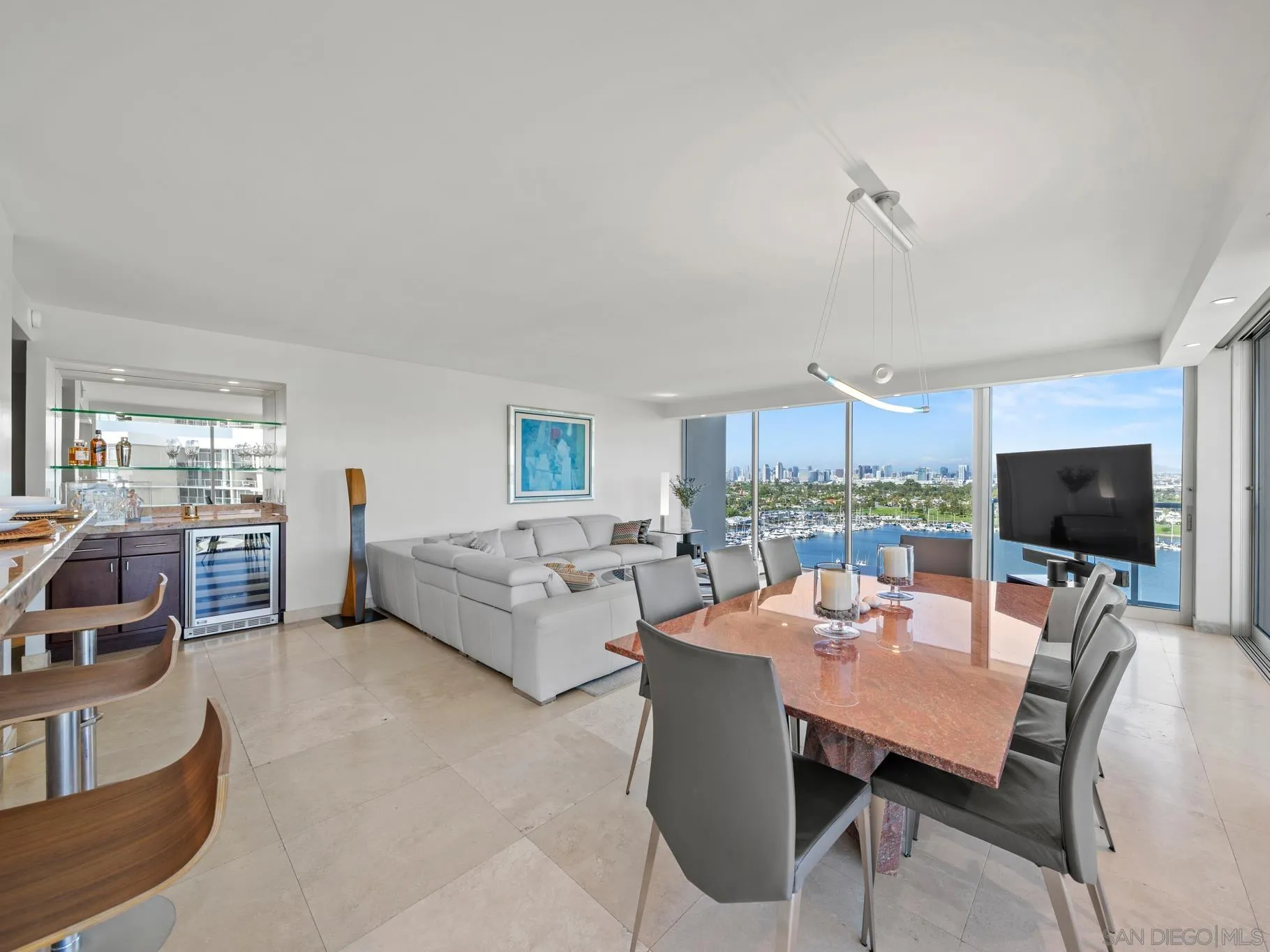 1730 Avenida Del Mundo, Unit 1503 Coronado, CA 92118 - Photo 3 of 47 a living room with furniture and a flat screen tv