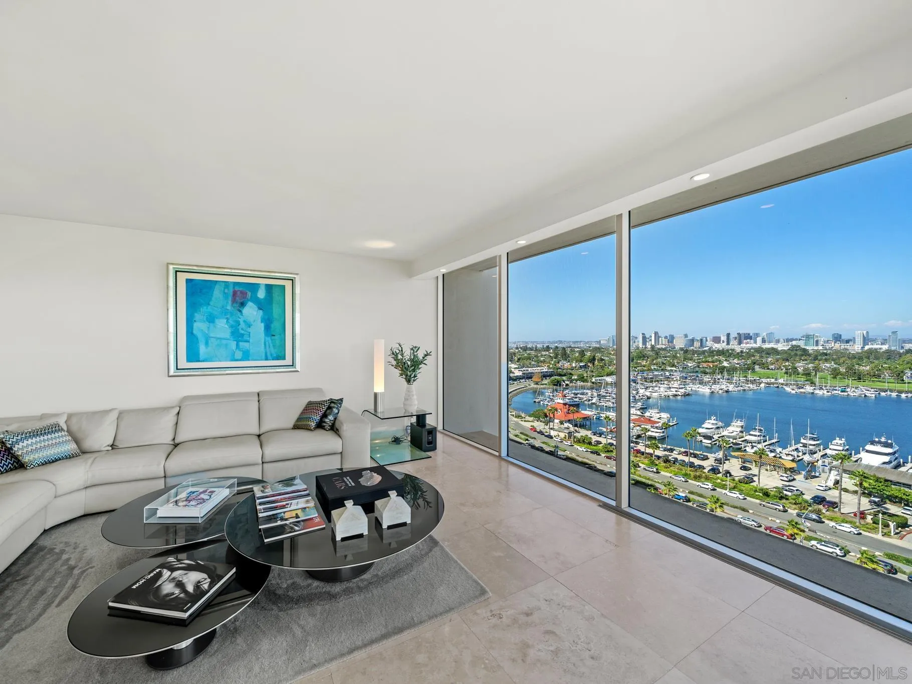 1730 Avenida Del Mundo, Unit 1503 Coronado, CA 92118 - Photo 5 of 47 a living room with furniture and a floor to ceiling window