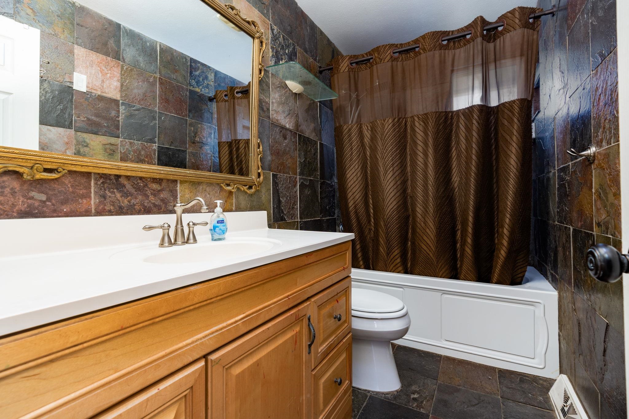 559 Court Road Grand Junction, CO 81501 - Photo 21 of 28 a bathroom with a sink a toilet and shower