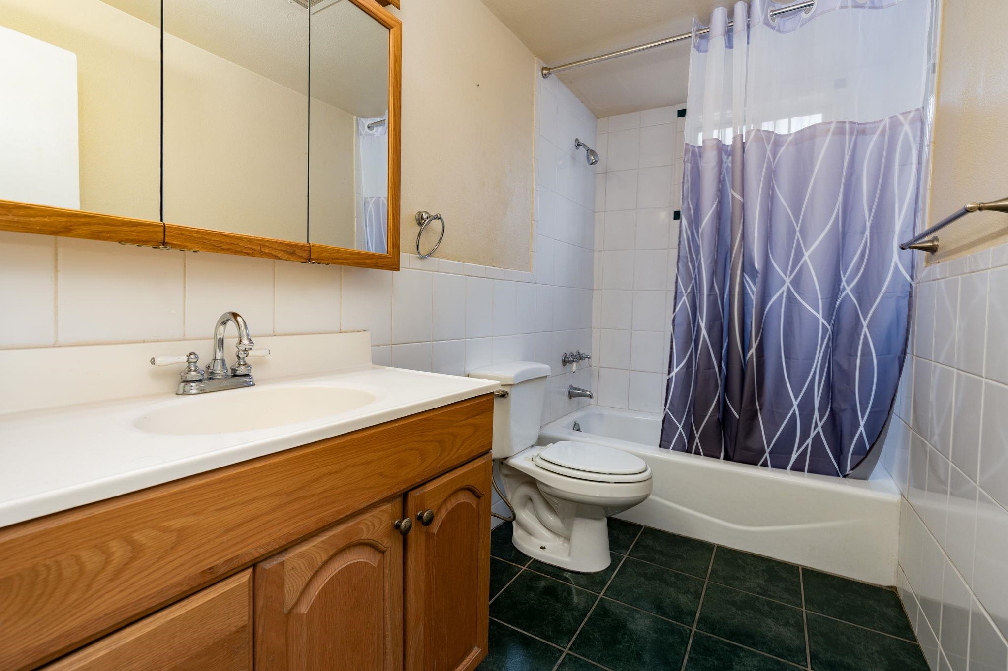 559 Court Road Grand Junction, CO 81501 - Photo 22 of 28 a bathroom with a sink a toilet and a shower