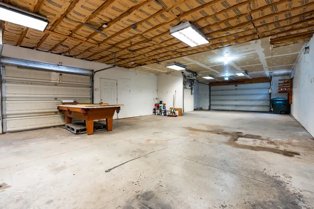 a view of the empty room with wooden ceiling