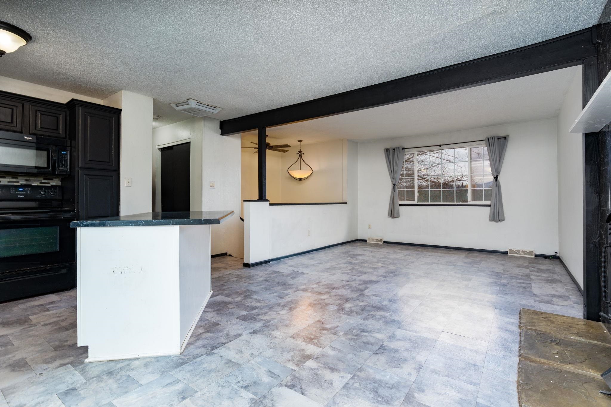 559 Court Road Grand Junction, CO 81501 - Photo 5 of 28 a view of an empty room with a kitchen