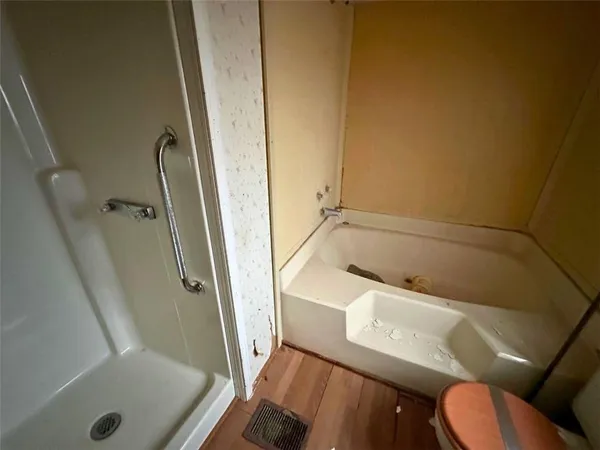 a bathroom with a tub and sink