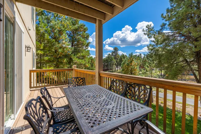 a view of a balcony with wooden floor
