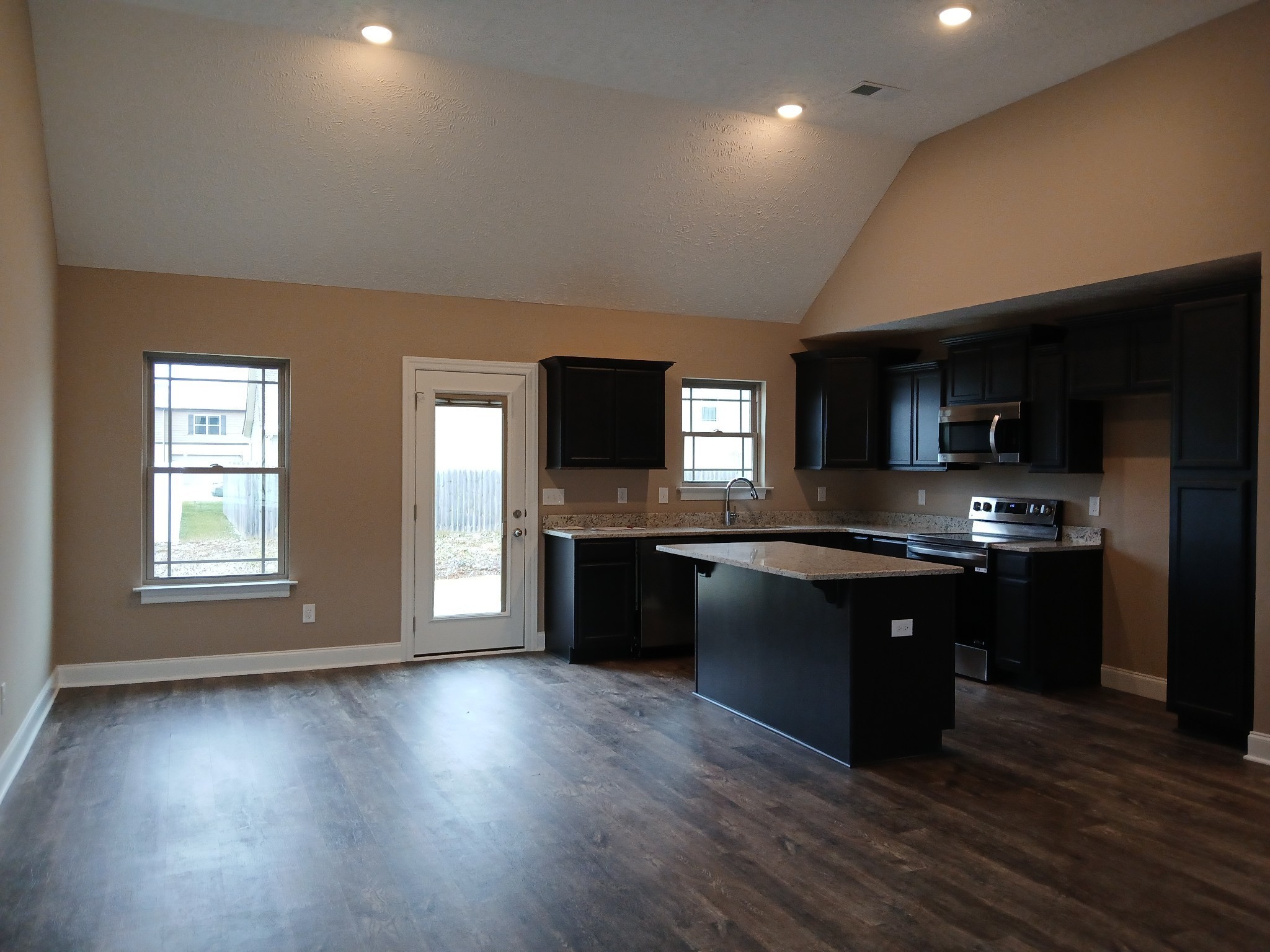 2859 Upstream Road Christiana, TN 37037 - Photo 9 of 72 a kitchen with stainless steel appliances granite countertop a sink and stove top oven