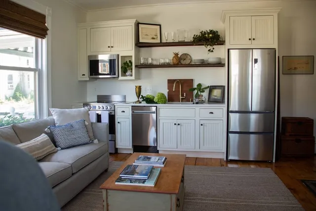 a kitchen with stainless steel appliances granite countertop a refrigerator sink and cabinets